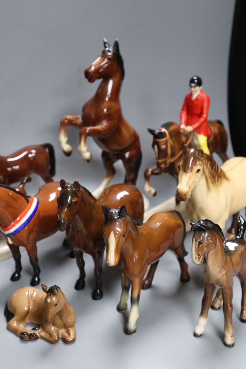 A collection of four various Beswick model horses including Highland, Another Bunch and Another Star, and three Continental horse model